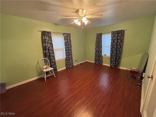 spare room featuring hardwood / wood-style flooring and ceiling fan