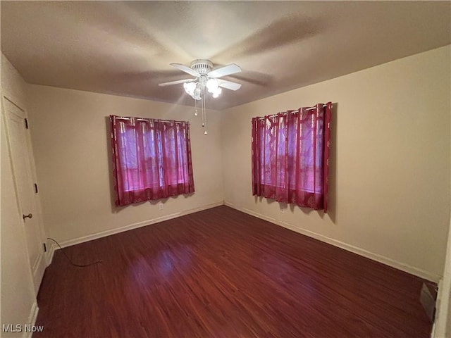 unfurnished room with hardwood / wood-style flooring and ceiling fan