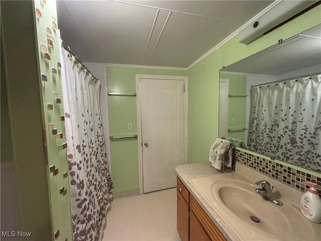 bathroom with backsplash, vanity, a shower with shower curtain, and ornamental molding