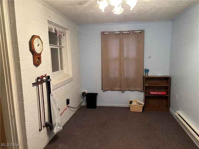 misc room featuring dark colored carpet, crown molding, baseboard heating, and a textured ceiling