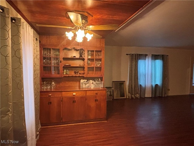 bar with ceiling fan, dark wood-type flooring, lofted ceiling, and wooden ceiling