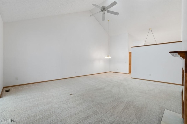 unfurnished living room featuring light carpet, high vaulted ceiling, and ceiling fan