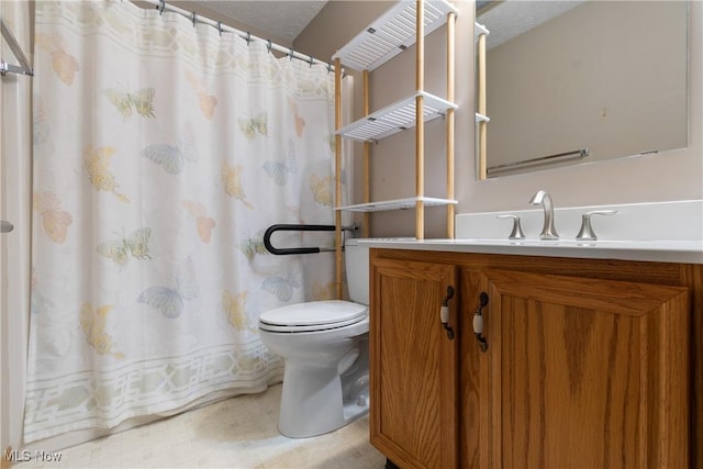 bathroom with vanity, a shower with shower curtain, a textured ceiling, and toilet