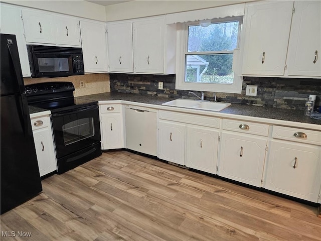 kitchen with decorative backsplash, light wood-type flooring, sink, black appliances, and white cabinets