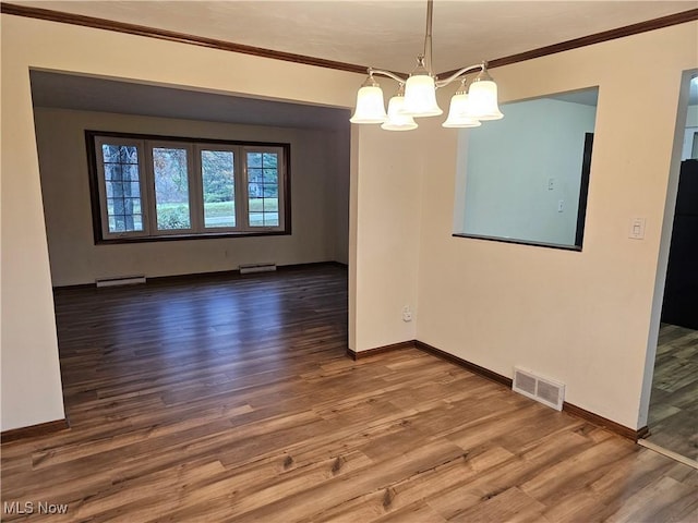 unfurnished dining area featuring baseboard heating, crown molding, hardwood / wood-style floors, and a notable chandelier