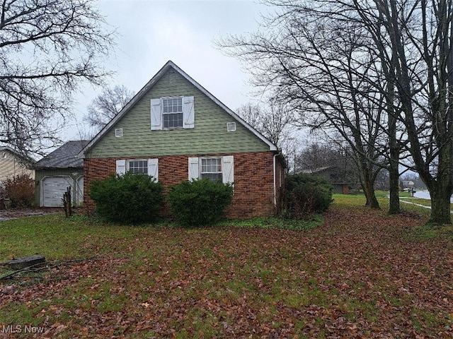 view of side of home with a garage