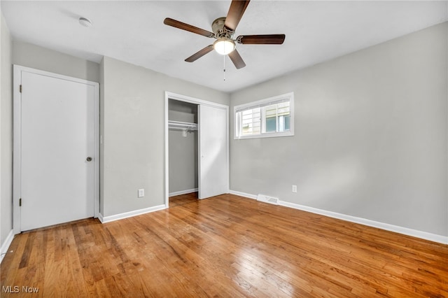 unfurnished bedroom with a closet, ceiling fan, and light hardwood / wood-style flooring