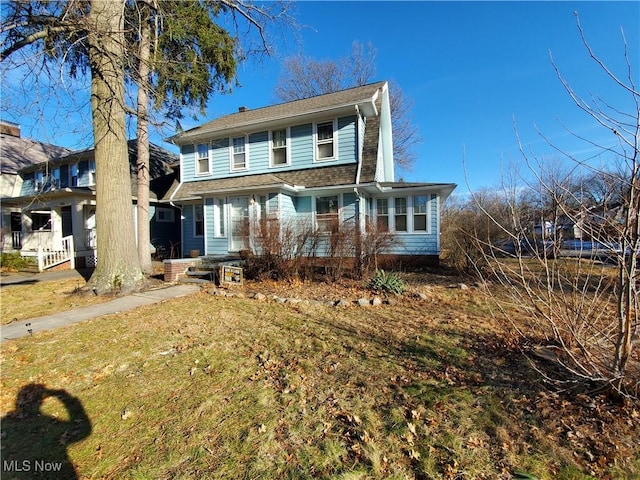 view of front property with a front lawn