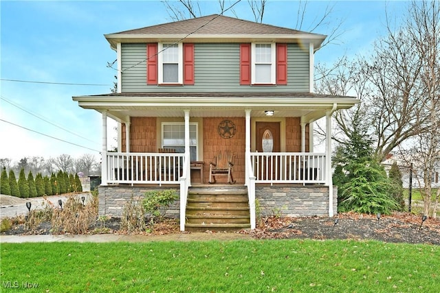 view of front property with a front lawn and covered porch