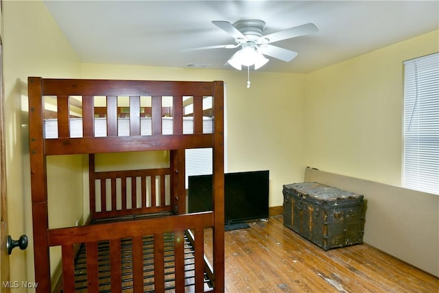 bedroom with hardwood / wood-style flooring and ceiling fan