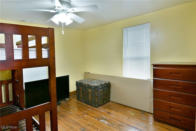 bedroom with ceiling fan and light hardwood / wood-style flooring