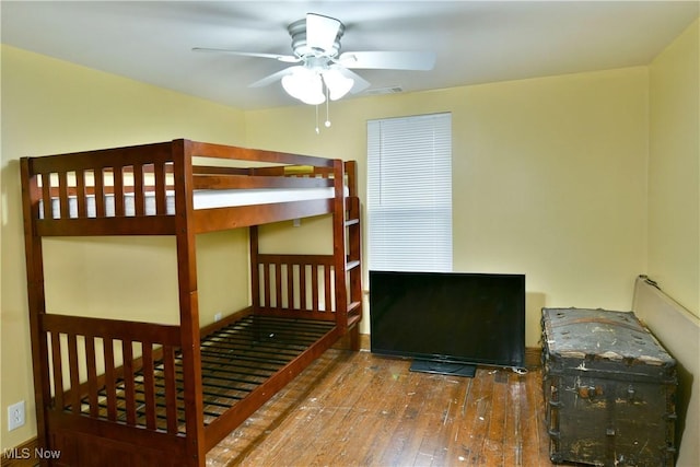 bedroom with ceiling fan and hardwood / wood-style floors