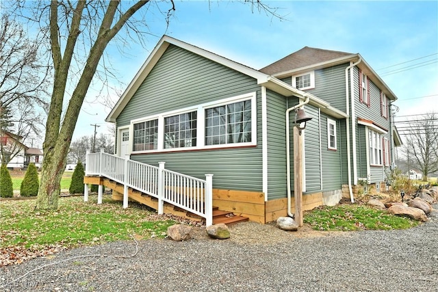 view of home's exterior with a deck