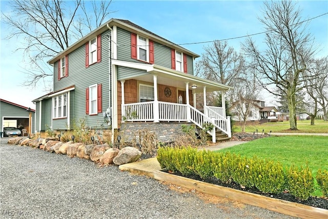 view of front of house featuring a front yard and a porch