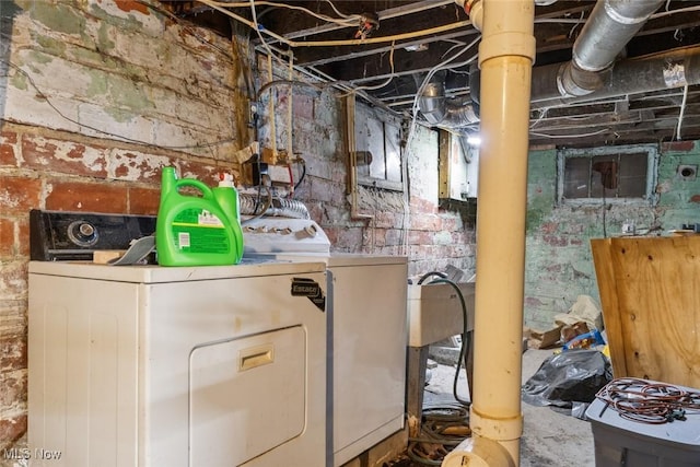 clothes washing area with independent washer and dryer