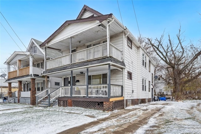 view of front of house featuring a balcony and a porch