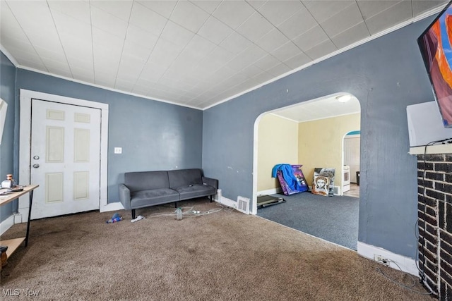 sitting room with carpet and ornamental molding