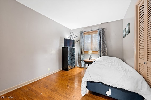 bedroom featuring wood-type flooring