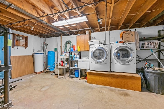 basement featuring sink and washer and dryer