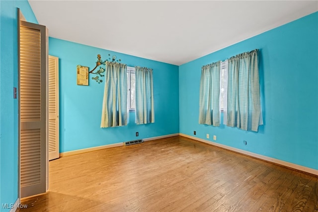 spare room featuring light hardwood / wood-style flooring