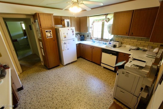 kitchen with decorative backsplash, sink, ceiling fan, and white appliances