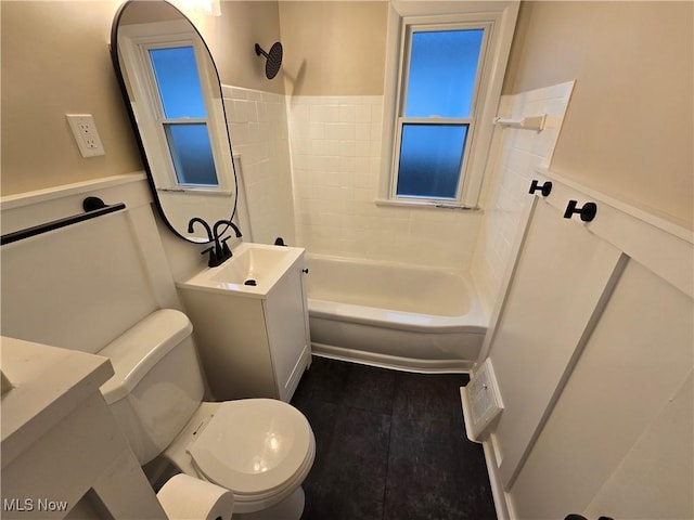 full bathroom with vanity,  shower combination, and toilet