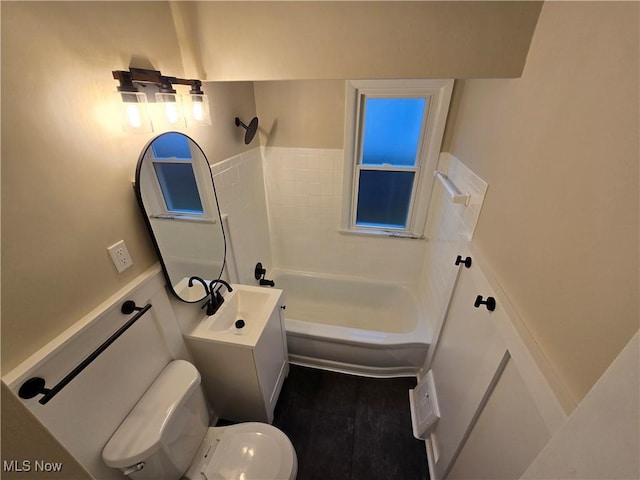 full bathroom featuring tile patterned flooring, vanity,  shower combination, and toilet