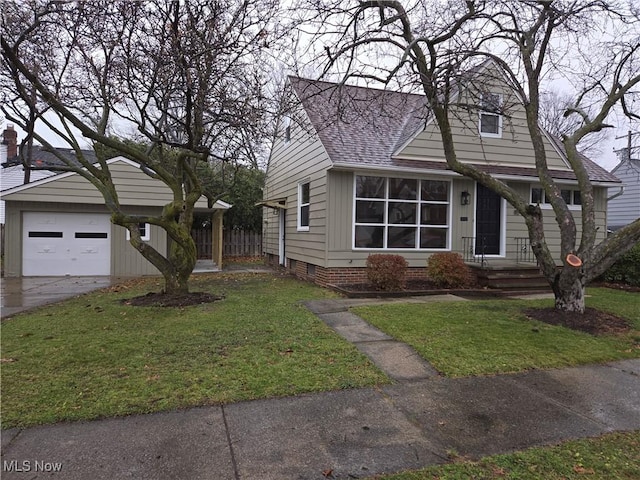 view of front of house with a garage and a front yard