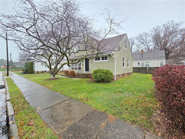 view of home's exterior with a yard