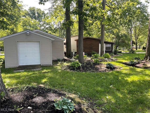 garage with a lawn