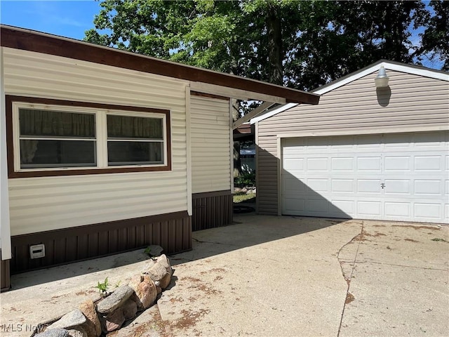 view of home's exterior featuring a garage and an outdoor structure