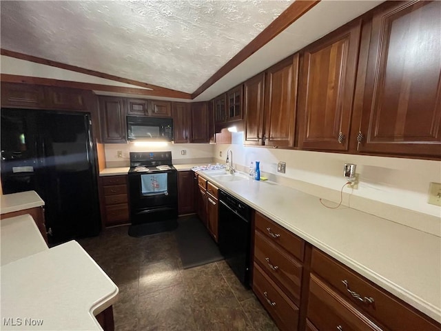 kitchen with a textured ceiling, sink, black appliances, and lofted ceiling