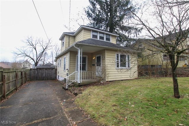 bungalow-style house with a front lawn