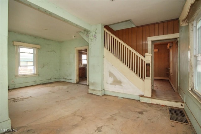 interior space featuring wooden walls