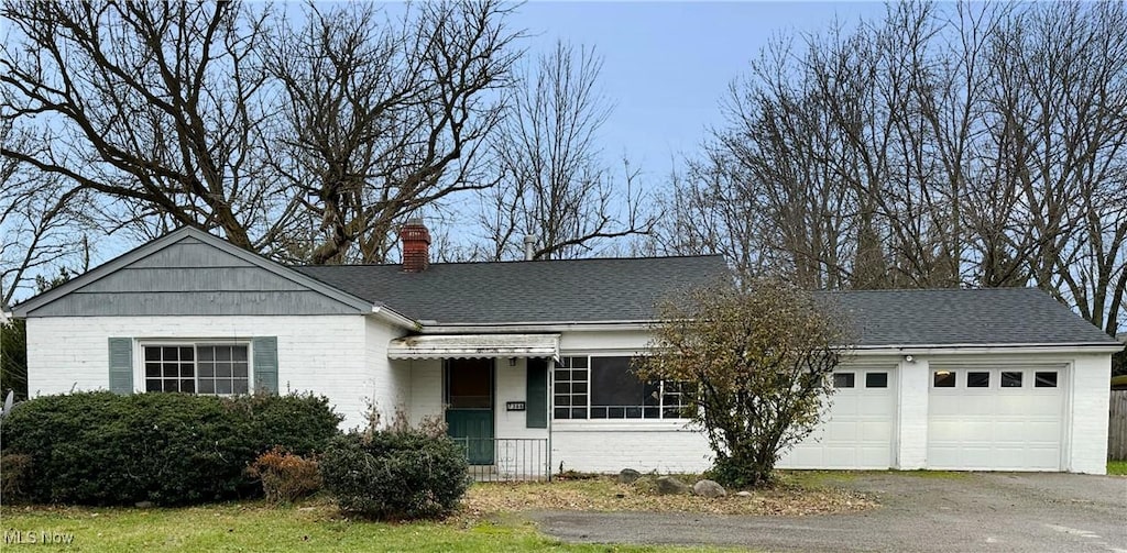 ranch-style house featuring a garage