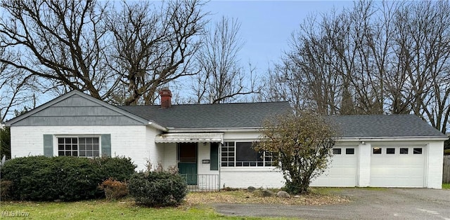 ranch-style house featuring a garage