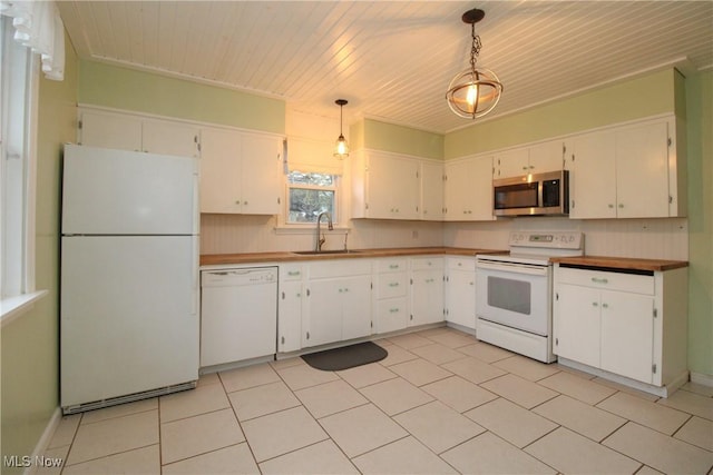 kitchen with white appliances, white cabinets, sink, decorative light fixtures, and wood ceiling