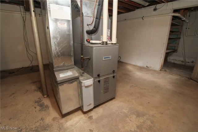 utility room featuring heating unit