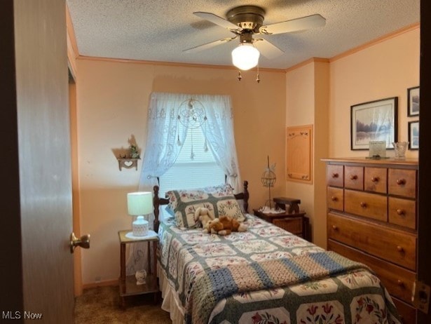 carpeted bedroom with ceiling fan, crown molding, and a textured ceiling