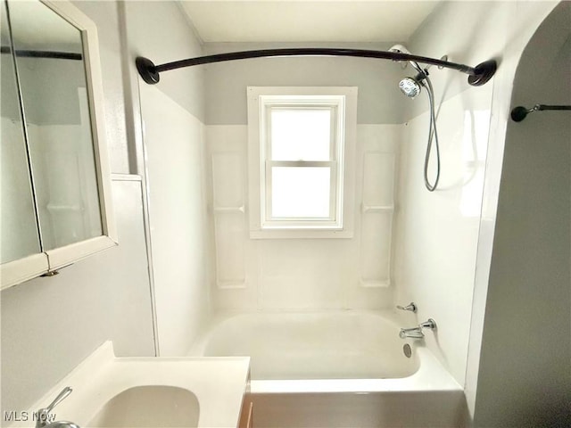 bathroom with vanity and  shower combination