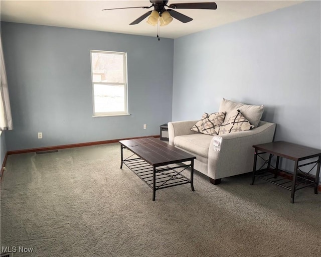 living room with carpet flooring and ceiling fan