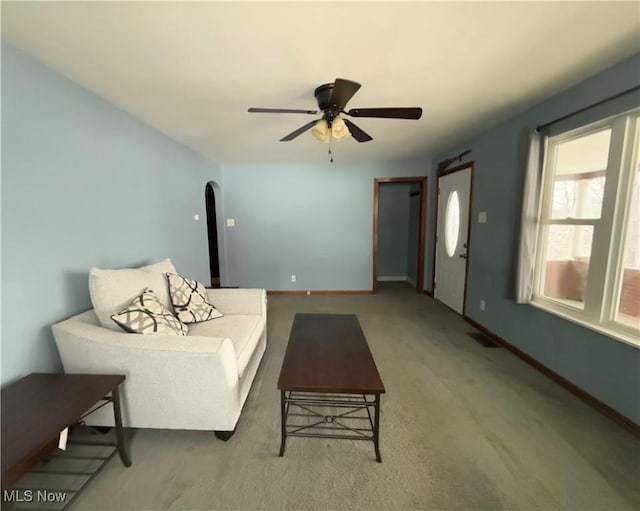 living room with ceiling fan and carpet floors