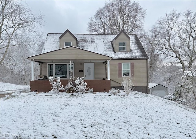 new england style home with covered porch