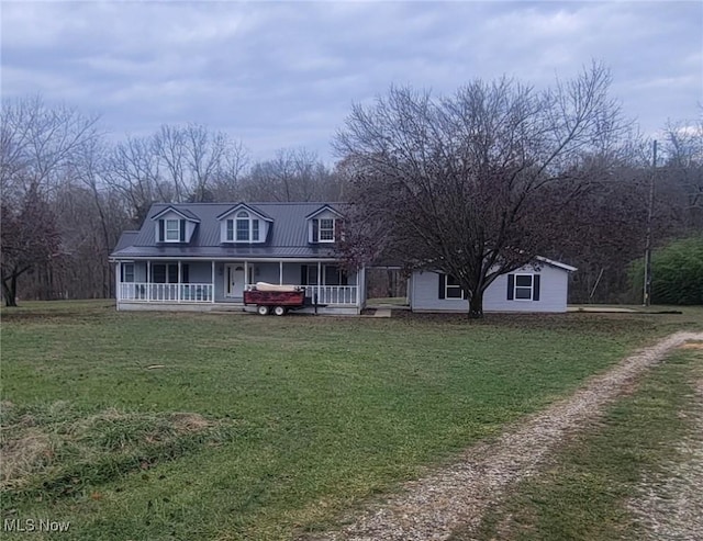 view of front of house featuring a front lawn and covered porch