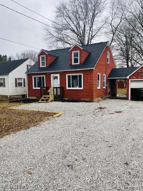 new england style home with a garage