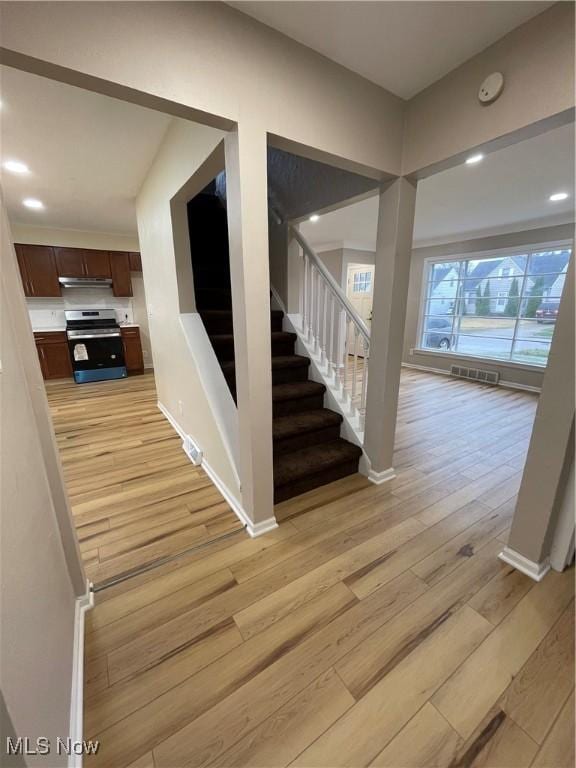 stairway featuring hardwood / wood-style flooring