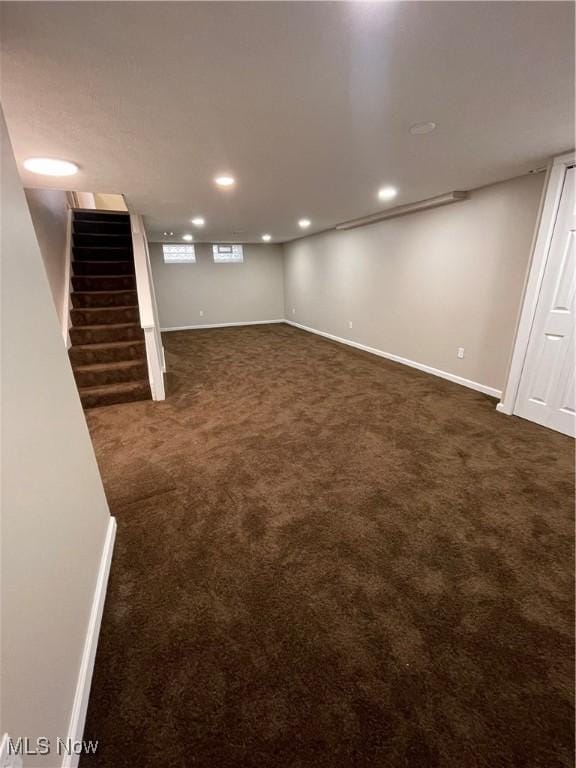 basement with dark carpet