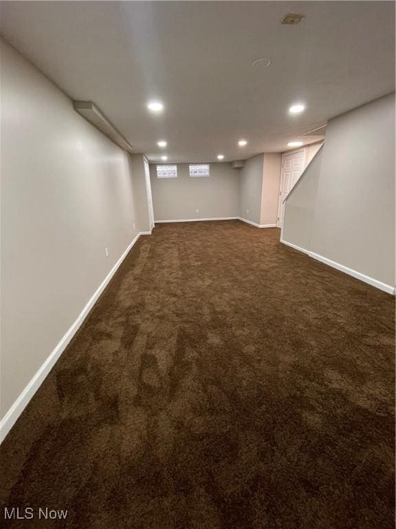 basement with dark carpet