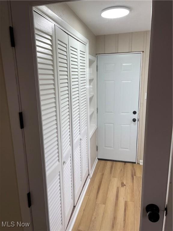 hallway featuring light wood-type flooring