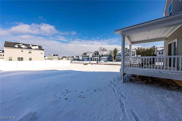 view of yard layered in snow